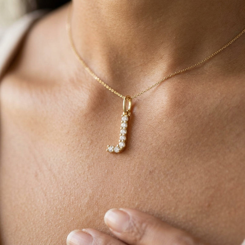 Worn: Accented Initial Necklace · 0.13–0.33 ct — AI-rendered styling image
