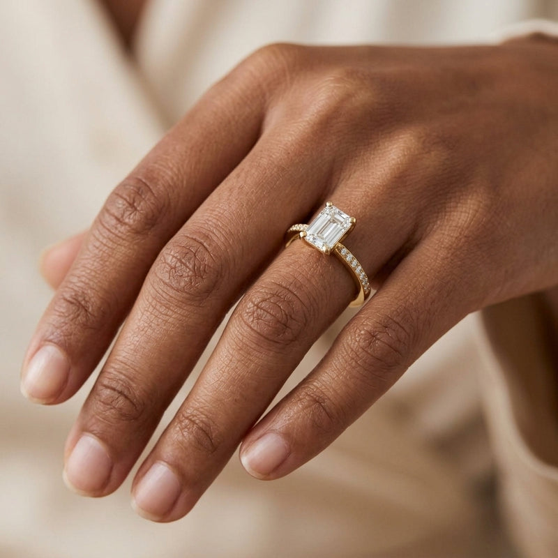 Worn: Accented Shank Emerald Engagement Ring · 0.75–1 ct — AI-rendered styling image
