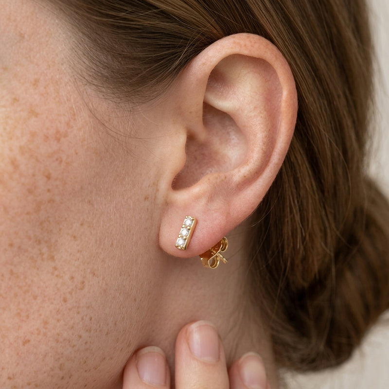 Worn: Bar Earrings · 0.05 ct — AI-rendered styling image
