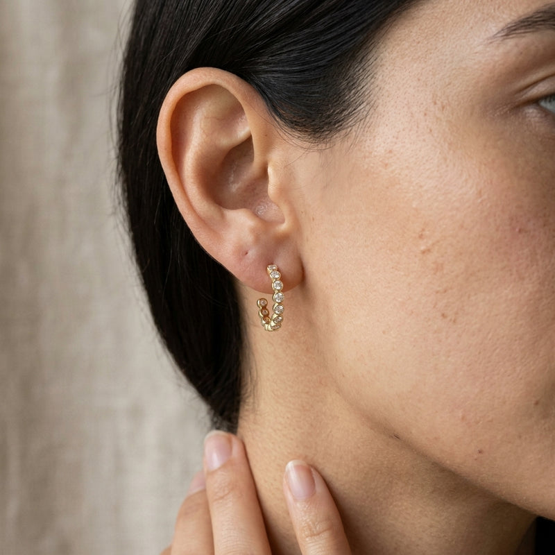 Worn: Bezel-Set Hoop Earrings · 0.33–0.38 ct — AI-rendered styling image