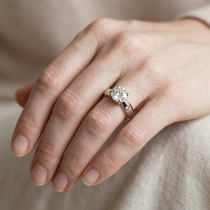 Worn: Bezel-Set Solitaire Engagement Ring · 0.5–1.5 ct — AI-rendered styling image