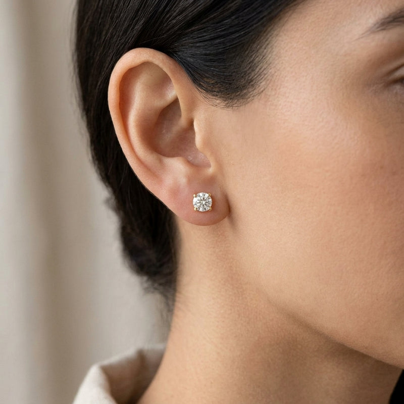 Worn: Round 4-Prong Cocktail-Style Stud Earrings · 0.13–2 ct — AI-rendered styling image