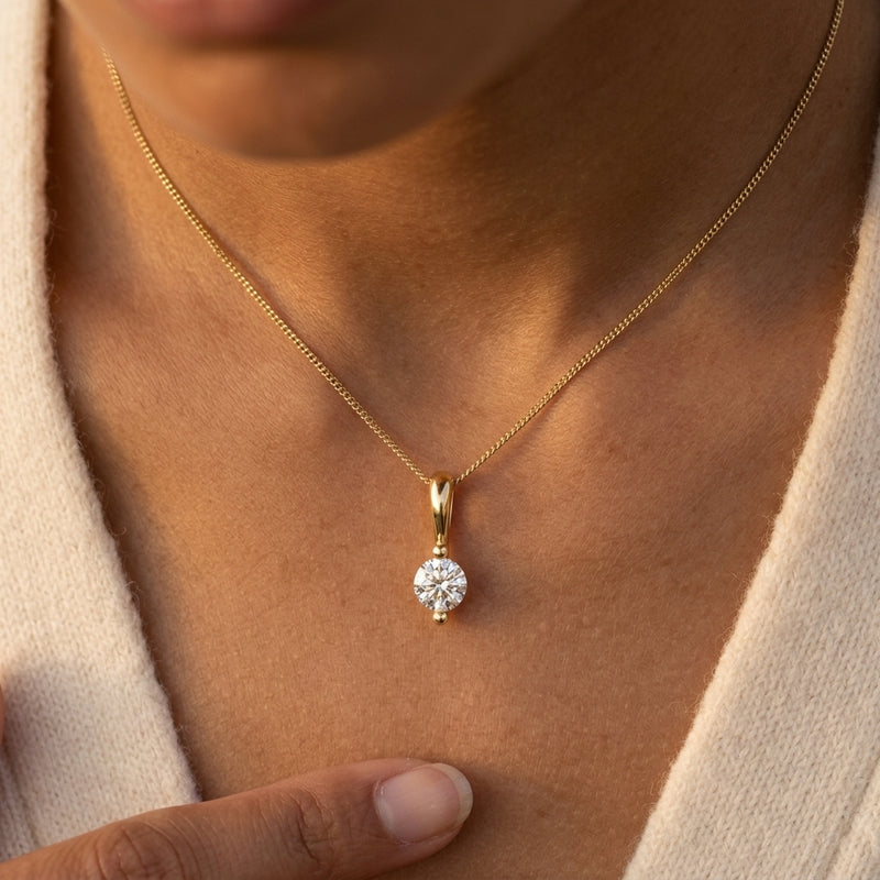 Worn: Solitaire Pendant · 2.03–4.25 ct — AI-rendered styling image