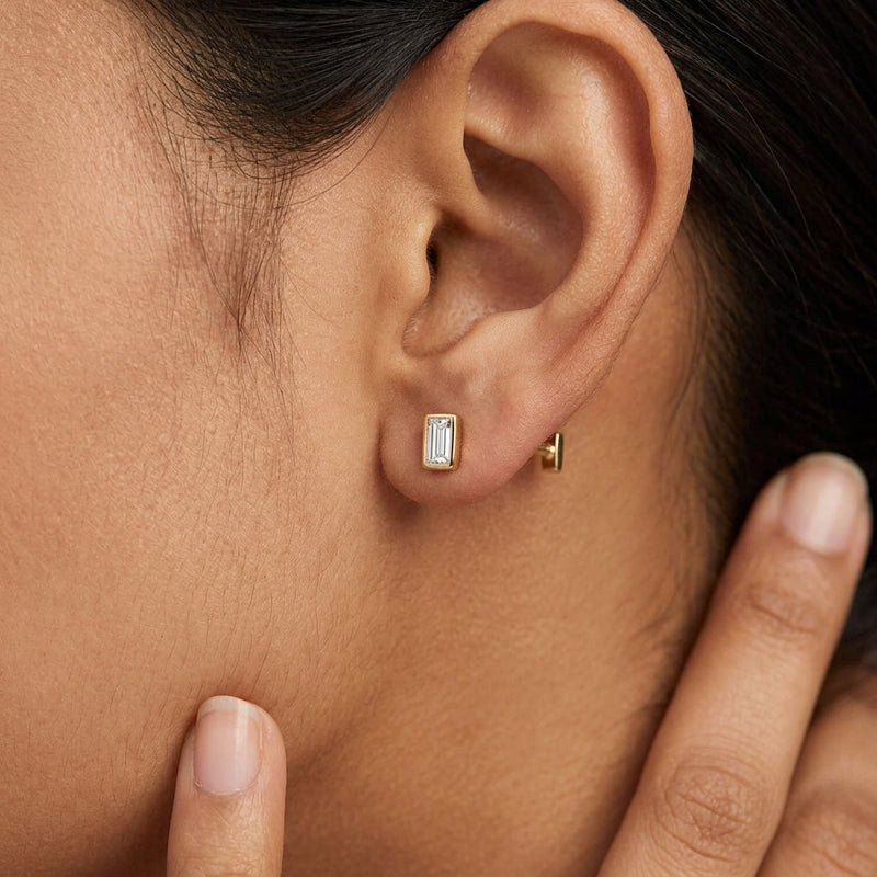 Worn: Straight Baguette Bezel-Set Stud Earrings · 0.03–0.1 ct — AI-rendered styling image