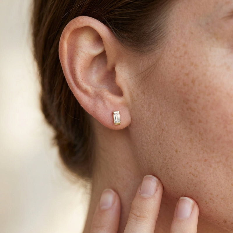 Worn: Straight Baguette Bezel-Set Stud Earrings · 0.08–0.38 ct — AI-rendered styling image