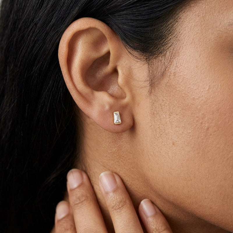Worn: Tapered Baguette Channel-Set Stud Earrings · 0.13–0.2 ct — AI-rendered styling image