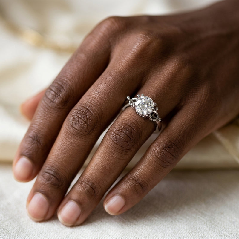 Worn: Three-Stone Engagement Ring · 2–3 ct — AI-rendered styling image